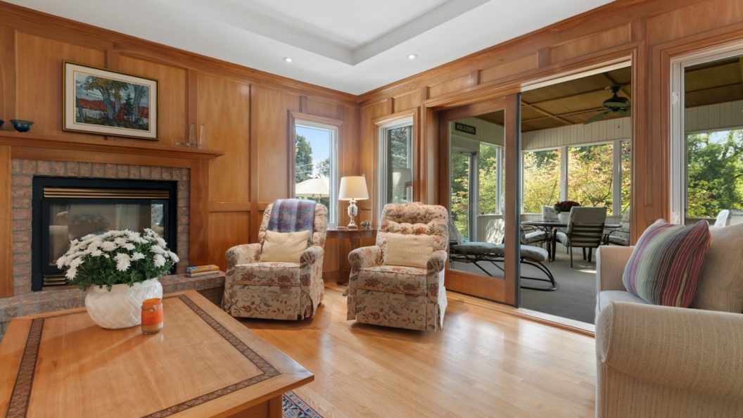 a living room filled with furniture and a fire place
