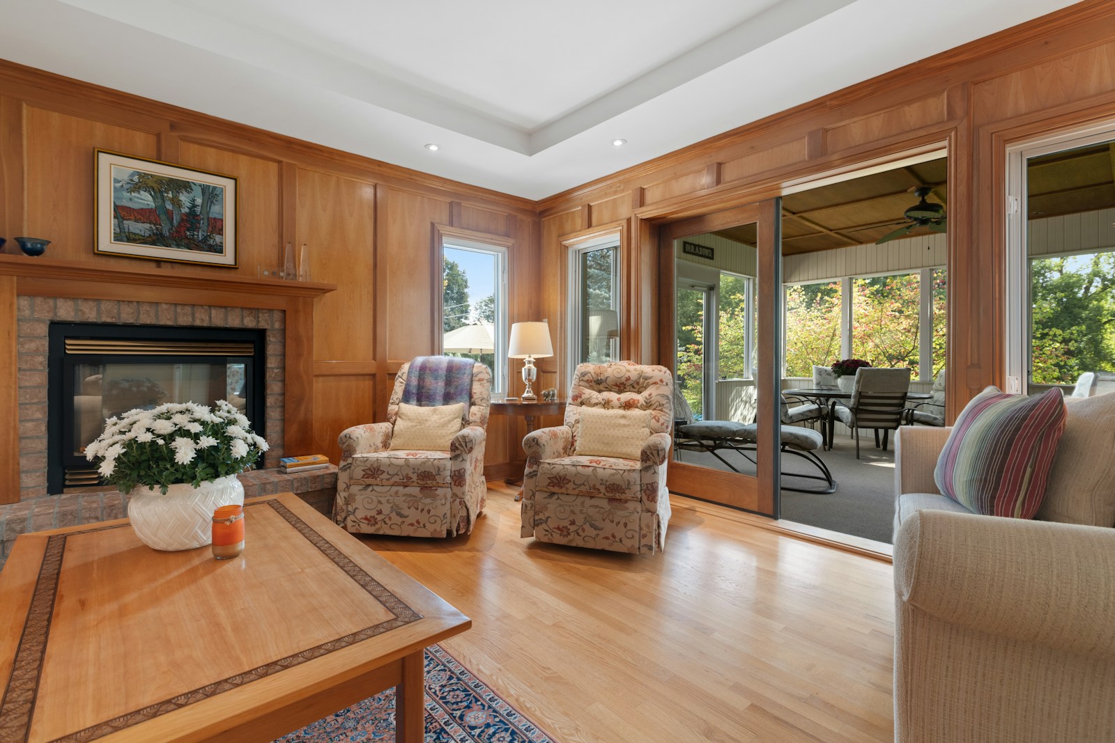 a living room filled with furniture and a fire place